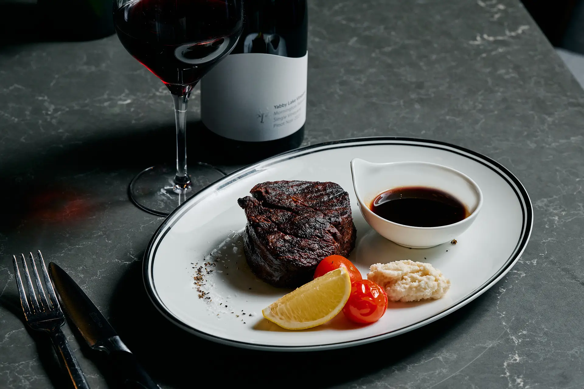 Grilled steak served with red wine at voco Melbourne Central
