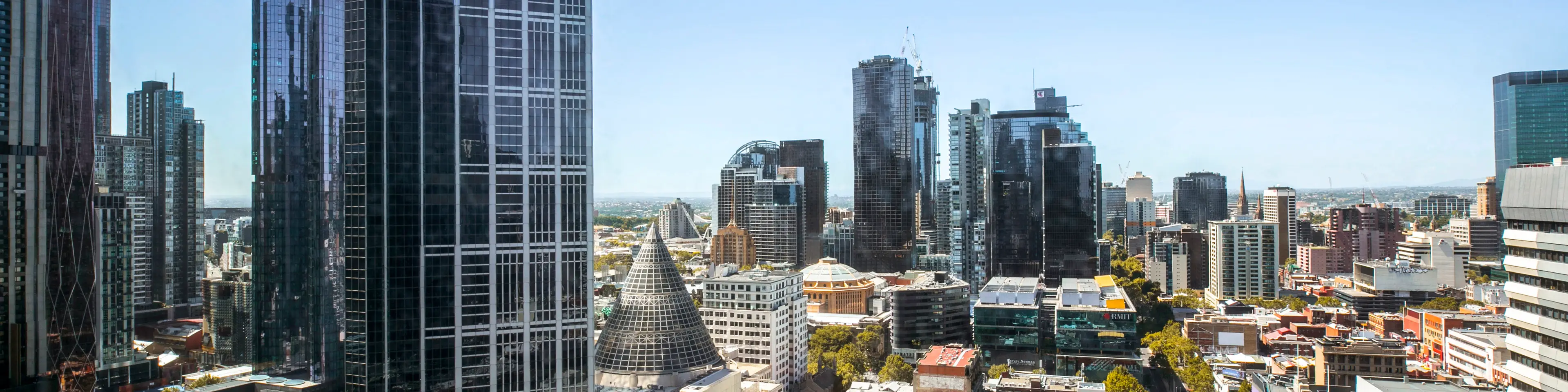 Elevated Melbourne city view with the Melbourne Central Shot Tower cone among surrounding buildings